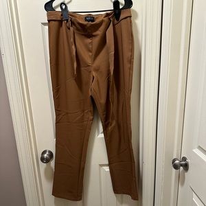 Fancy Brown work pants. Tie in the front. Size 8